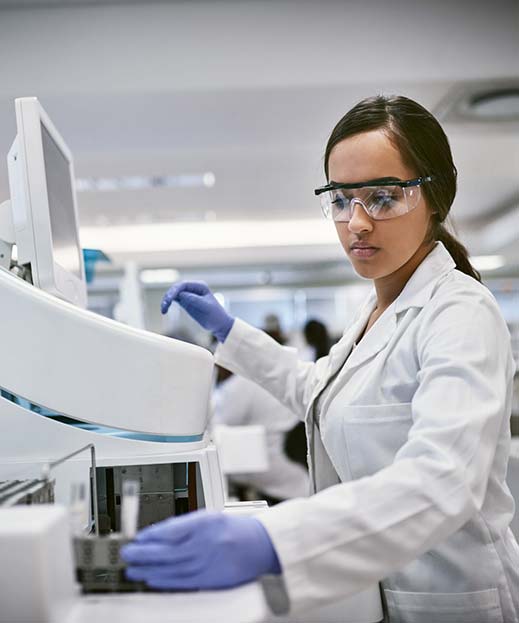 medical professional processing testing vials in a lab