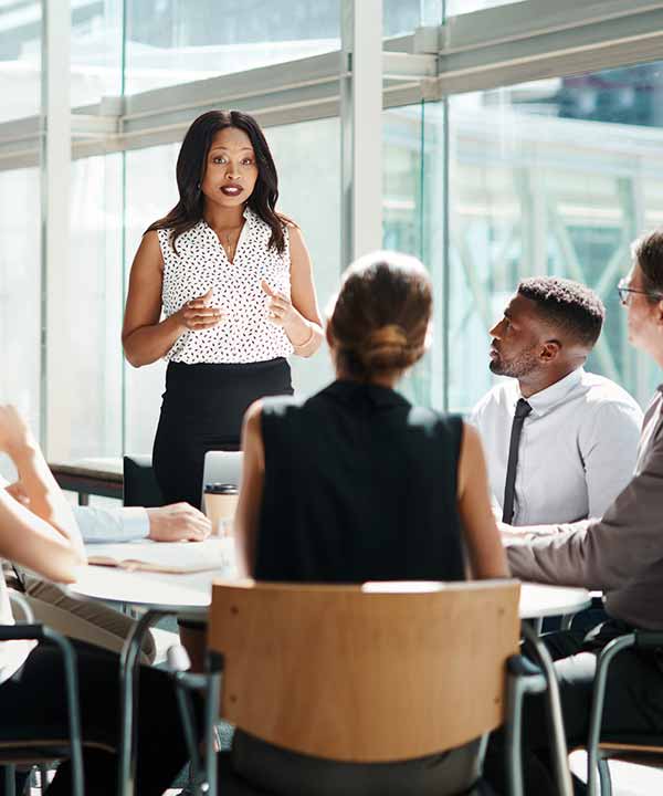 woman of color addresses colleagues