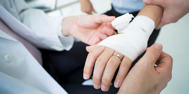 doctor wrapping a hand