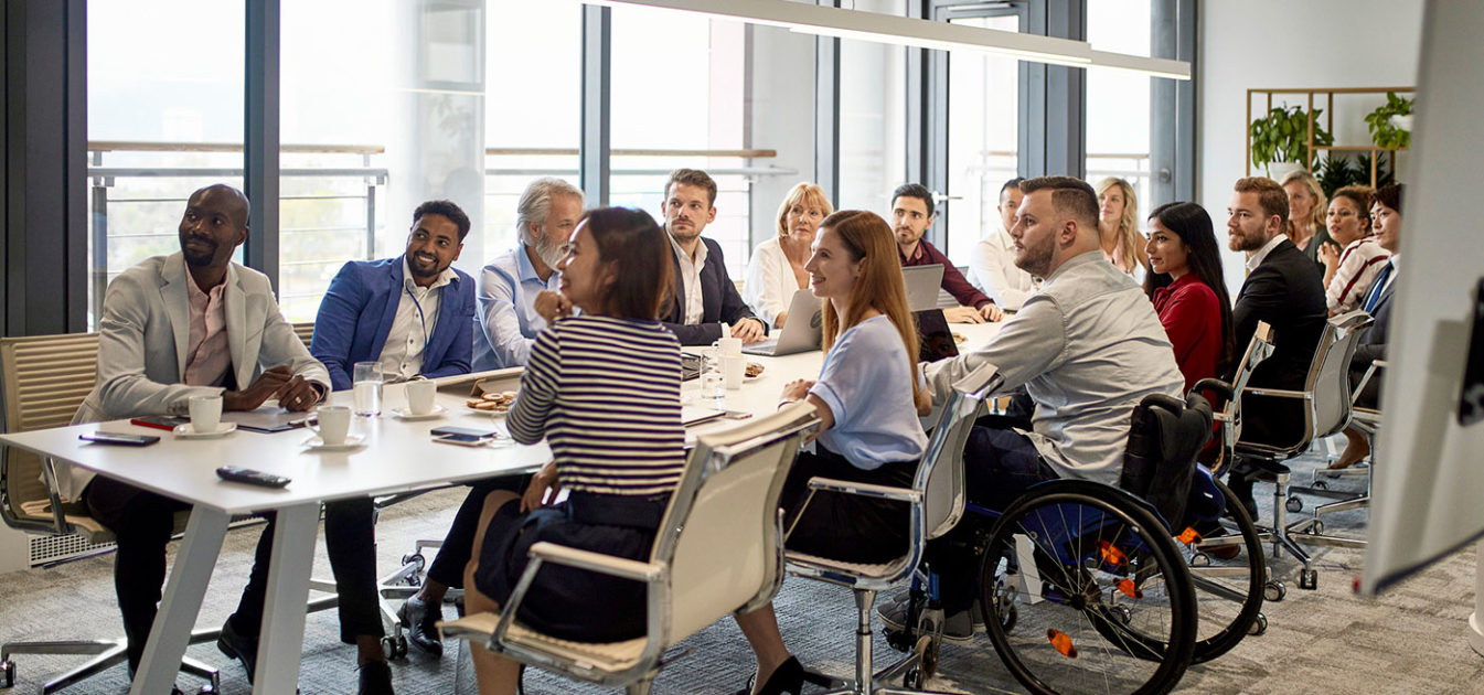 committee meets at a long table