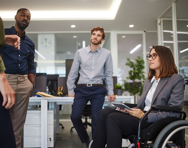 diverse colleagues talking at office