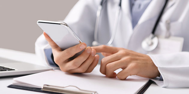 doctor uses mobile phone