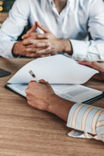 two professionals reviewing a document