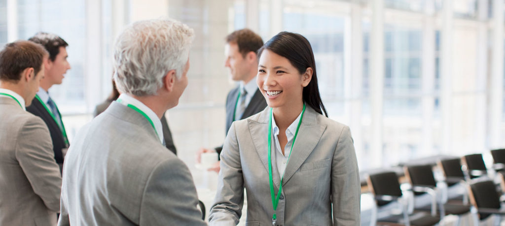 event attendees greet each other