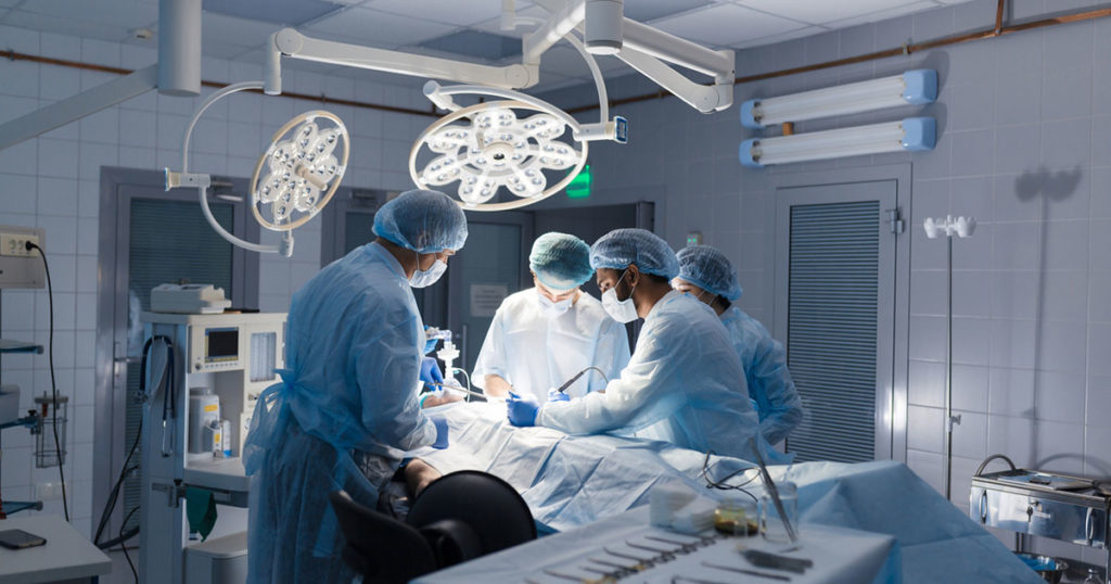 surgeons at work in an operating room