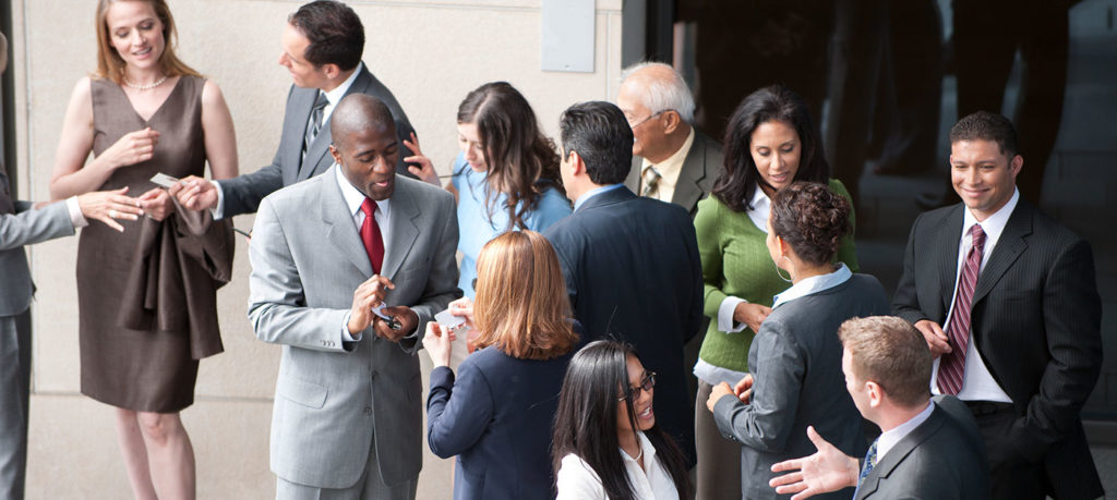 event attendees converse at reception