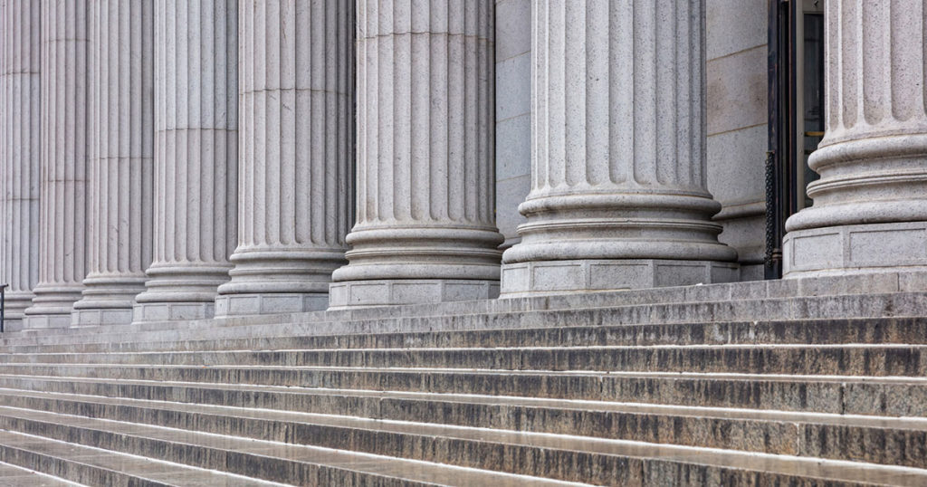 steps lead up to marble columns