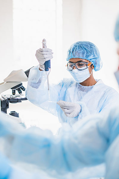 two lab technicians working with vials