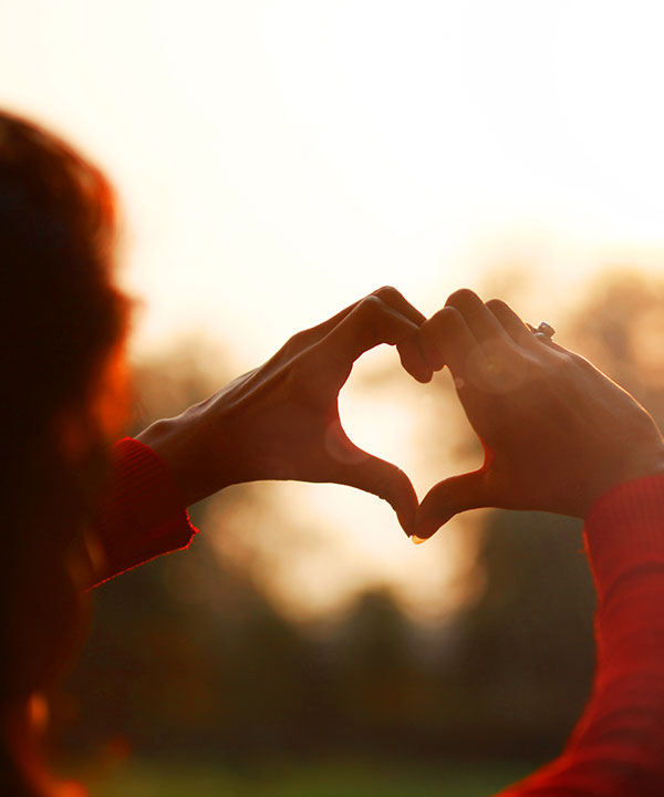 hands held in the shape of a heart