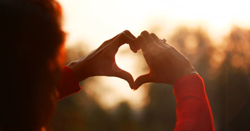 hands held in the shape of a heart