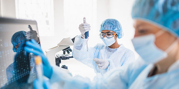 two lab technicians working with vials