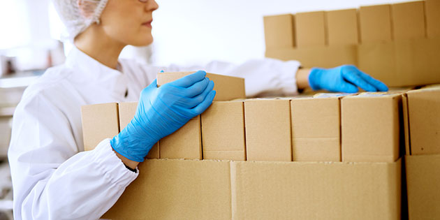gloved health worker inventories packages