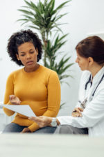 doctor speaking with patient