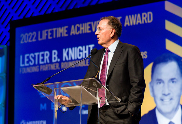 Lester Knight speaking on stage