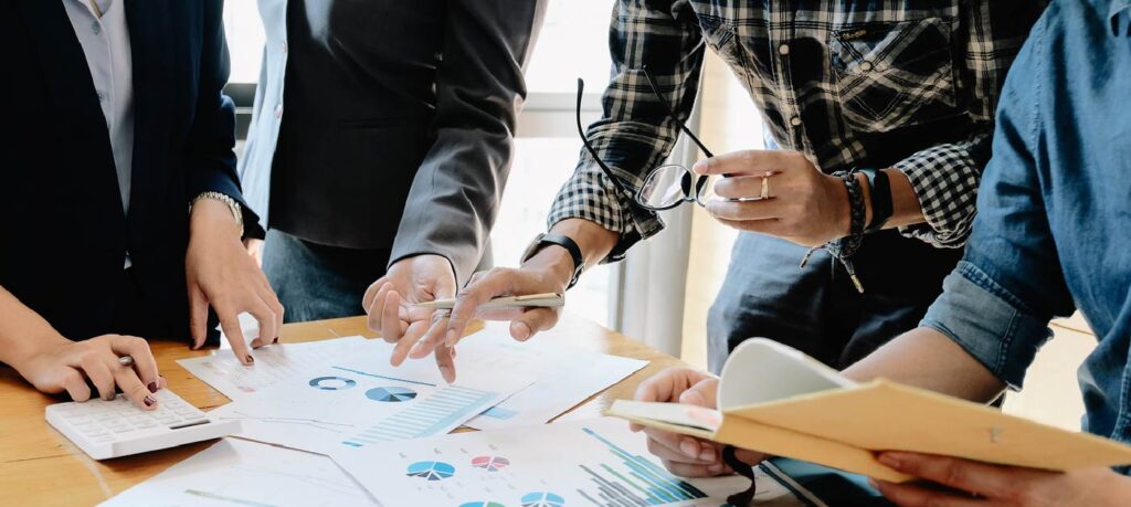 group of business people reviewing documents