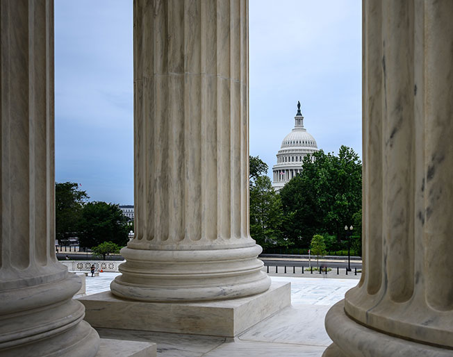 Capitol Hill viewed between columns