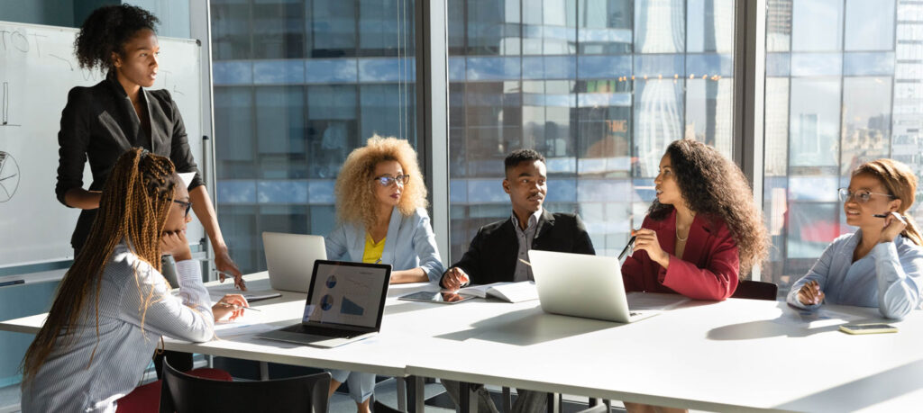 women in discussion at an office meeting