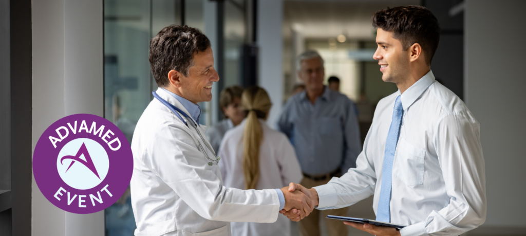Male doctor smiling and shaking hands with young businessman.