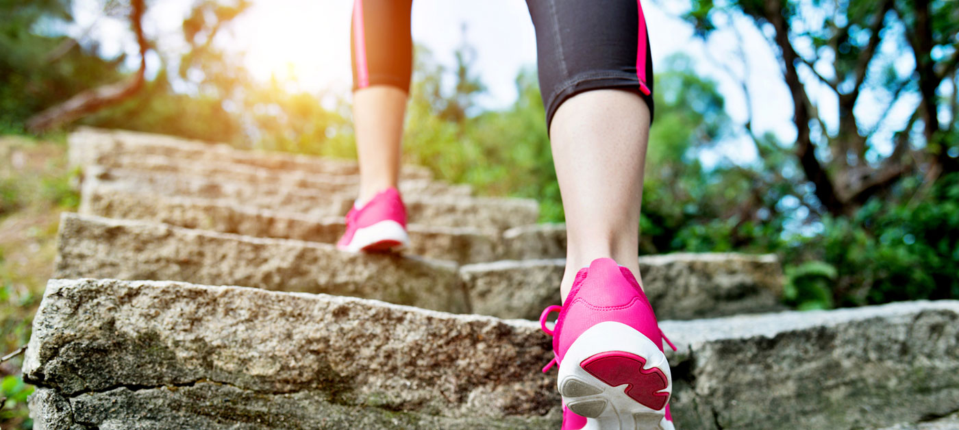 feet with sneakers ascending outdoor steps