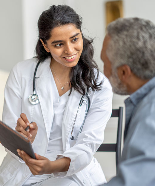 smiling doctor consulting with patient