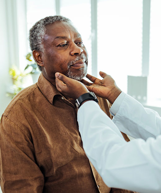 senior patient receiving exam