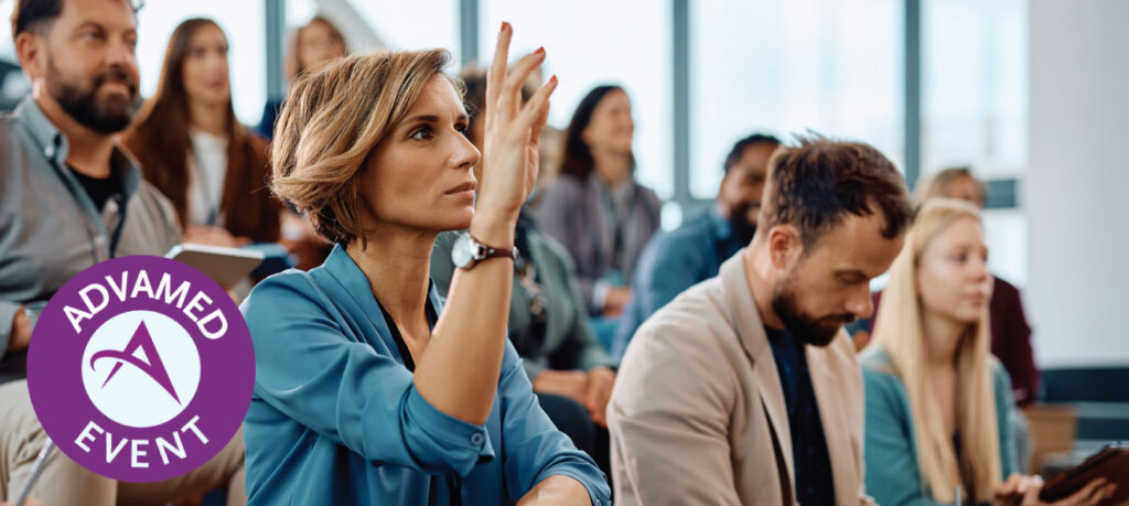Woman raising her hand to ask questions at a workshop