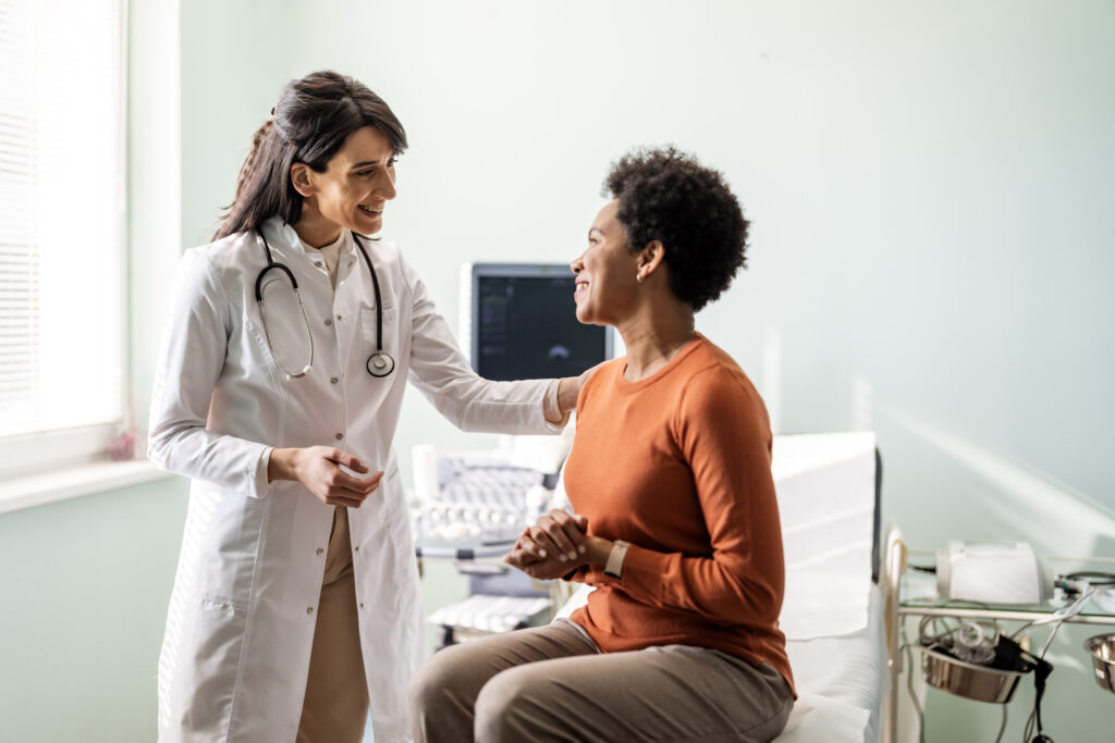 Female doctor interacting with a female patient
