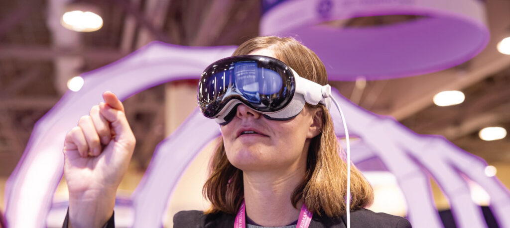 woman wearing vr goggles with her hand up pointing