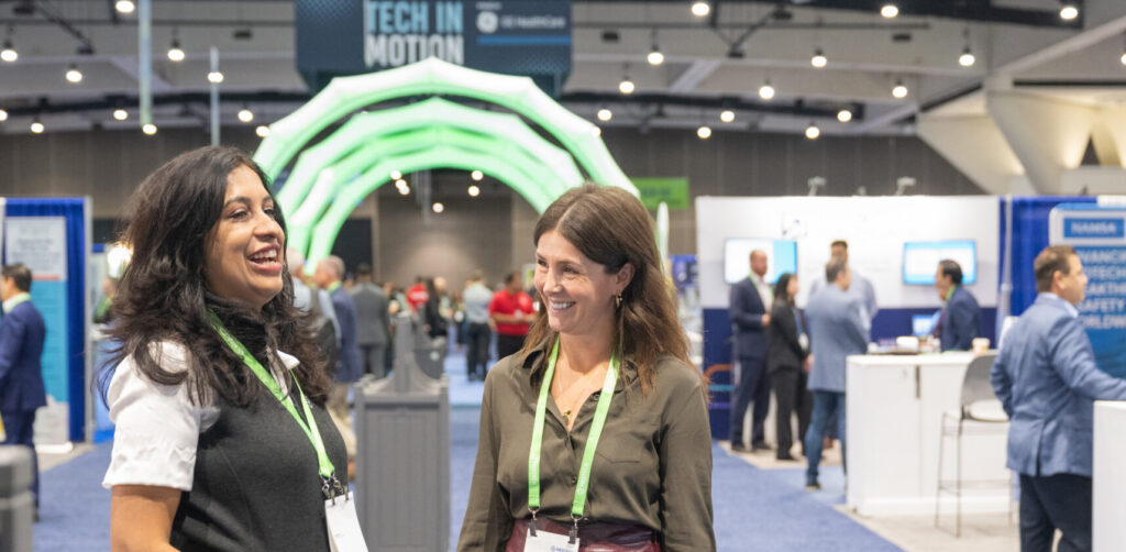 Medtech Conference Two Women Networking in Exhibit Hall