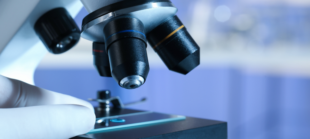 closeup picture of a lens underneath a microscope