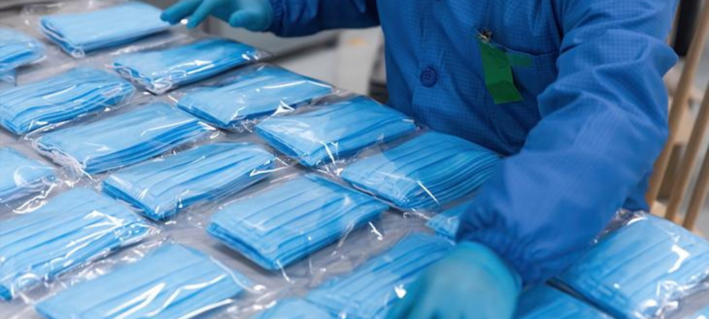person wearing protective gear organizing supplies